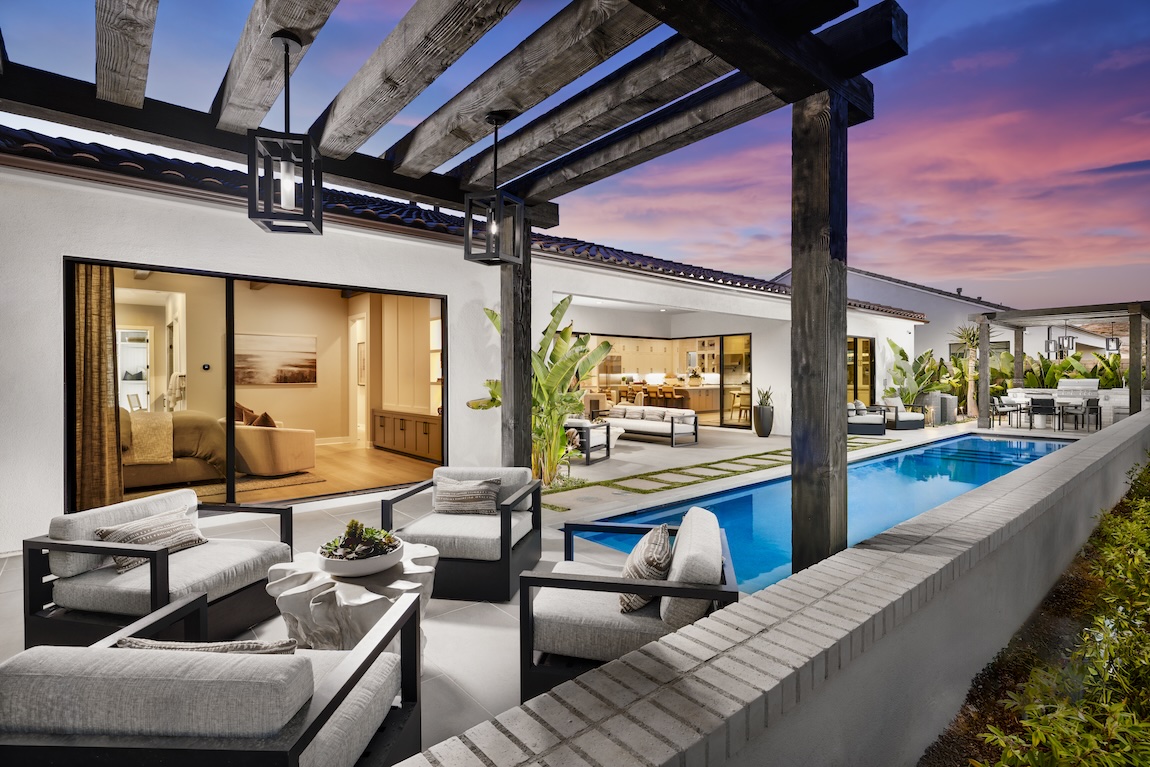 outdoor living space with plush seating by the pool