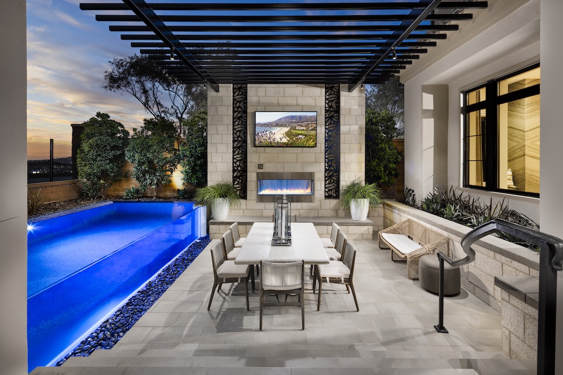 outdoor living space with dining table and black pergola