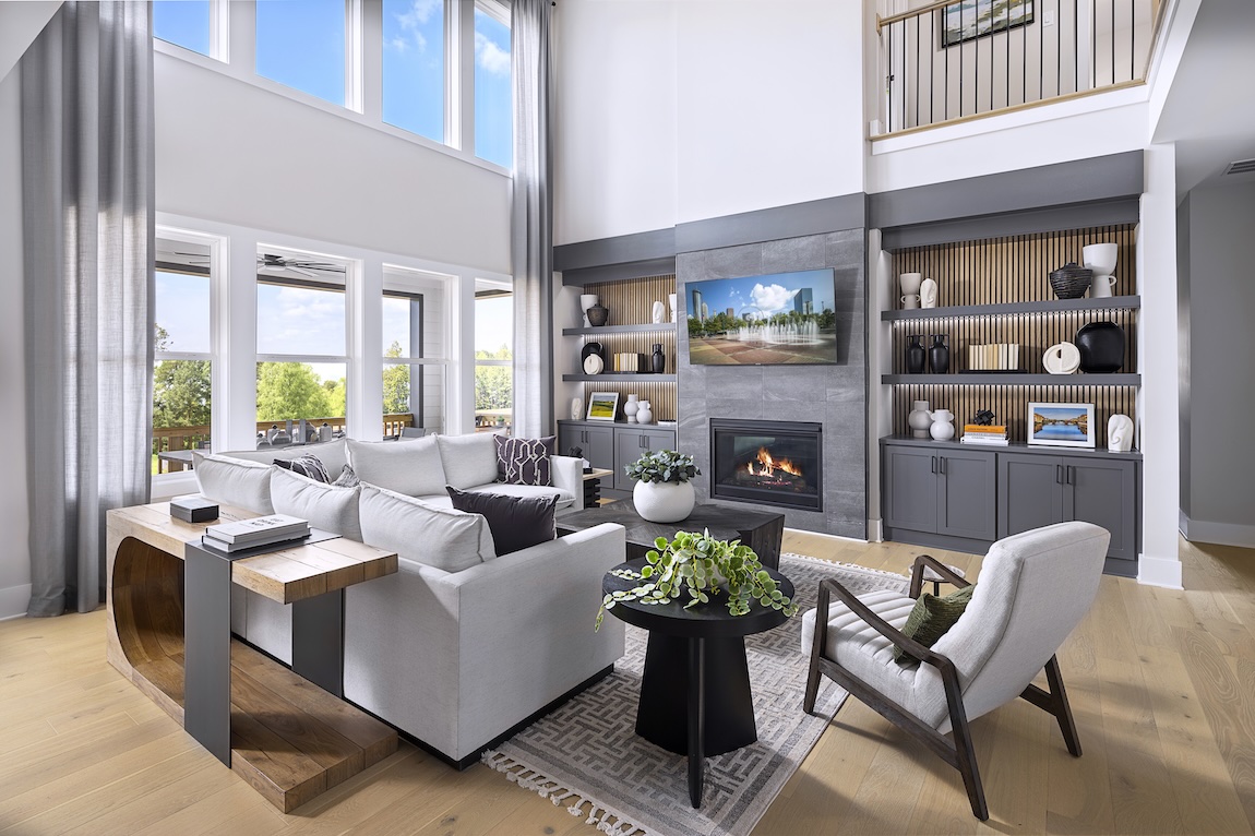 living room with large sectional couch and fireplace as the focal point