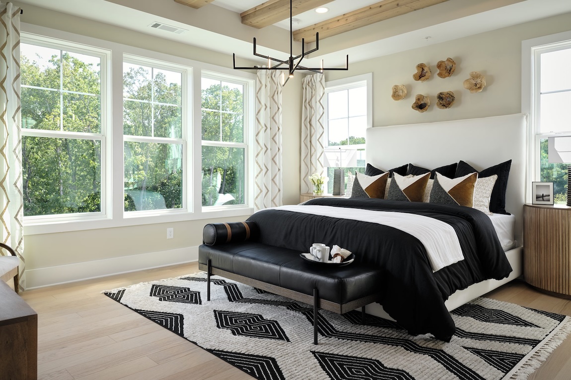 modern primary bedroom with black decor