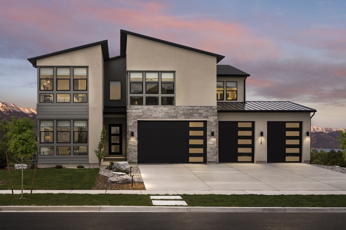 exterior of home with black colors and a sunset backdrop