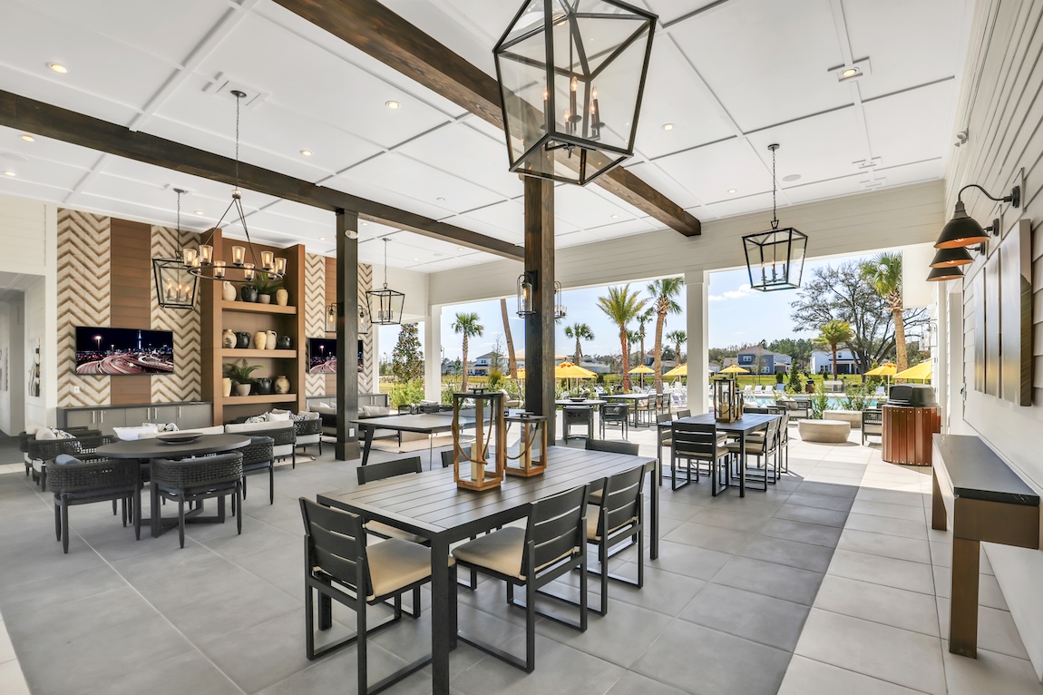 amenity center at Bartram Ranch in St. Johns, Florida, featuring dining and entertainment areas as well as a communal pool