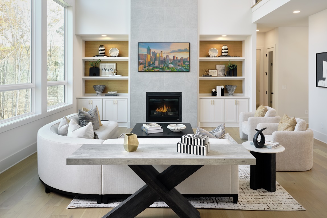 modern living room with fireplace and circular sofa