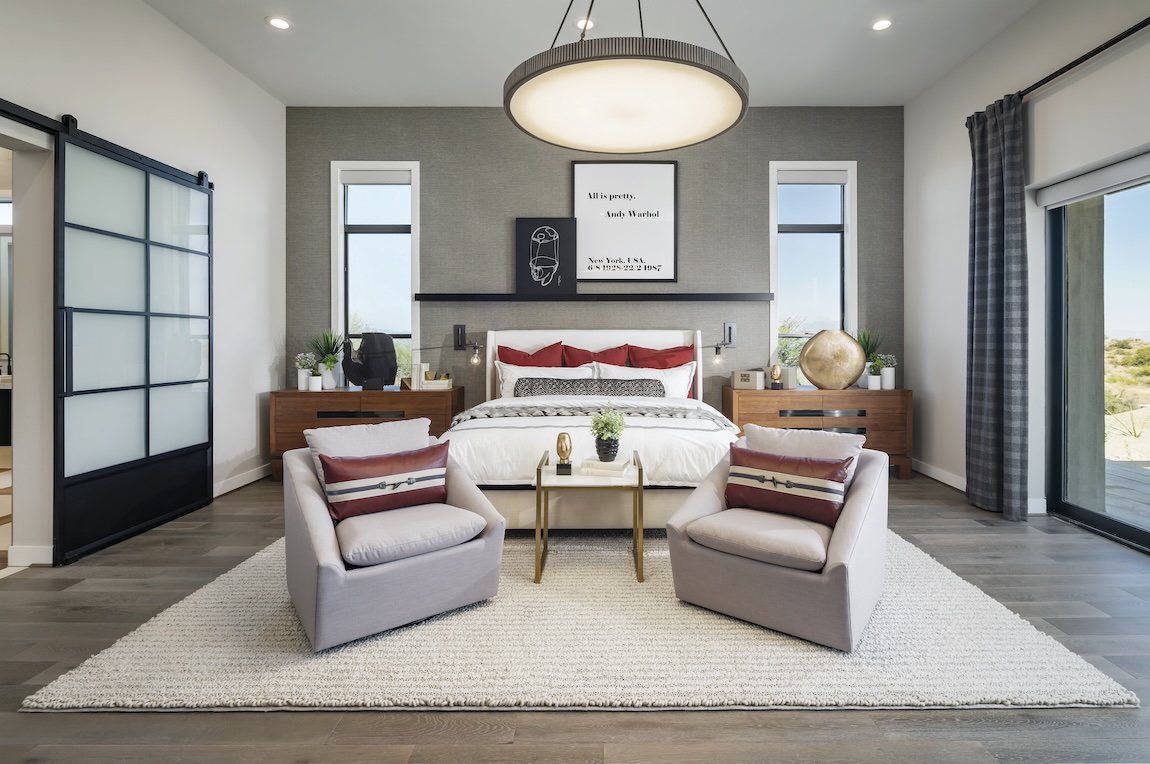 expansive first-floor primary bedroom design featuring outdoor transition