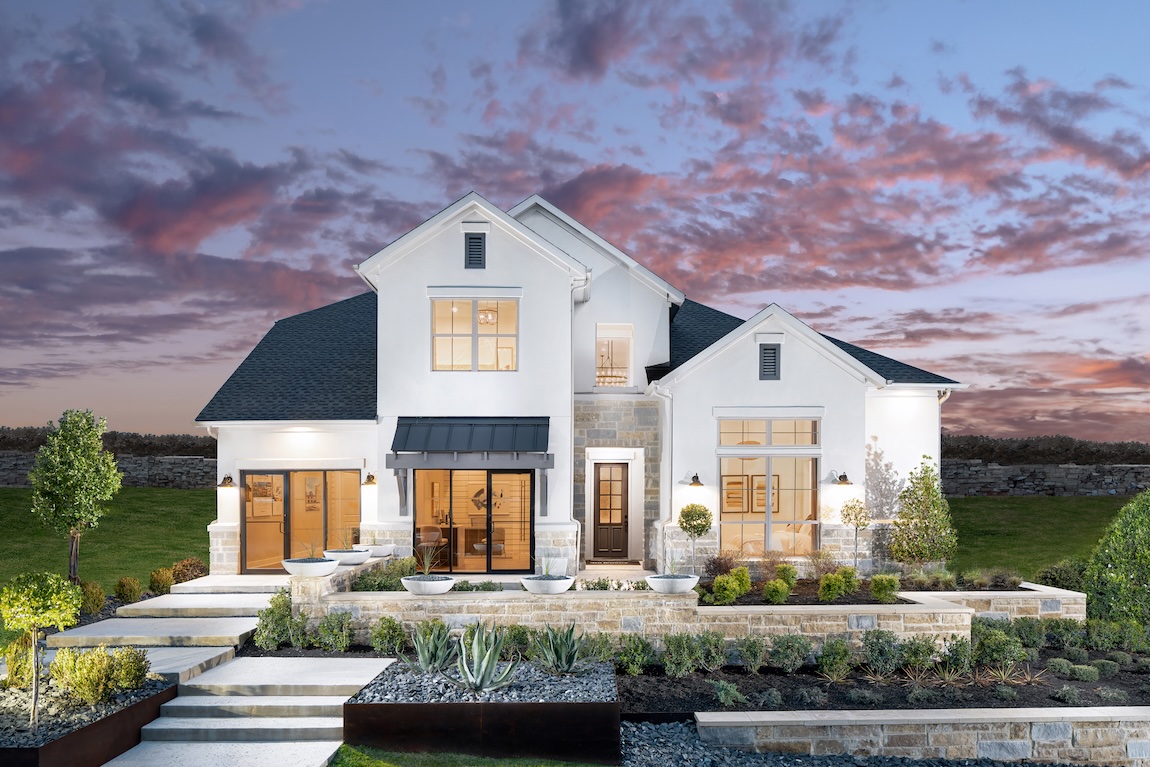 Luxury home design with light, airy front exterior color palette combined with metal rafters and texas limestone